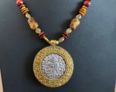 Brass and Silver Repousse pendant from Nepal, Yellow and red Tigers eye beads, brass beads