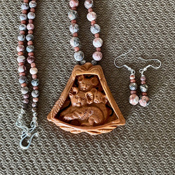 Carved red malachite Koala bears strung with brecciated red jasper beads