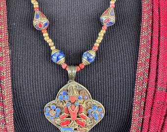 Buddha sitting atop a Lotus dias. Antique Tibetan brass filigree pendant / broach  from Nepal