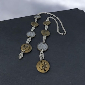 Ekuele metal Yin Yang ekwele opele of Orula Orunmila Ifá Santeria divination oracle Ifá