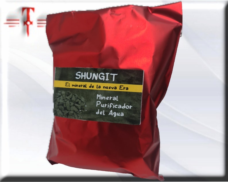 May include: A red foil pouch with a label that reads "Shungit El mineral de la nueva Era Mineral Purificador del Agua".