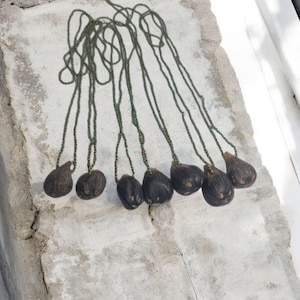 Ifá protection necklace with Oduso Ikin 6 eyes, ritualized African pendant