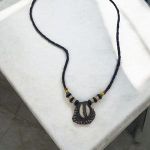 African amulet attracts luck - African art amulets - Secrets of Fon Vodoun, Benin - religious art