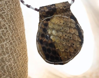 African snake amulet for protection against weapons, knives, and fights; Temple of the Python; secrets of Vodun; traditional African art