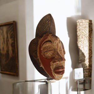 Ancient Punu mask Gabon traditional African art