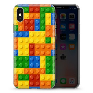 May include: A clear phone case with a colorful Lego brick pattern. The case is designed to fit an iPhone.