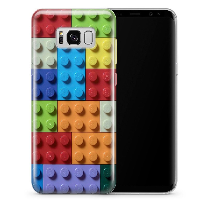 May include: A clear phone case with a colorful Lego brick pattern. The case is designed for a Samsung Galaxy S8 phone.