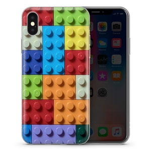 May include: A clear phone case with a colorful Lego brick pattern. The case is designed for an iPhone X.