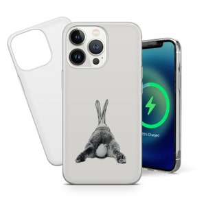 May include: A clear phone case with a black and white image of a rabbit's rear end. The case is designed for an iPhone with a camera bump. The phone case is shown on a white background.