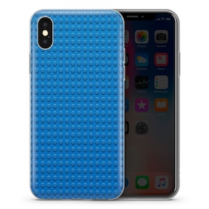 May include: A clear phone case with a blue Lego-like pattern on the back. The case is designed for an iPhone.