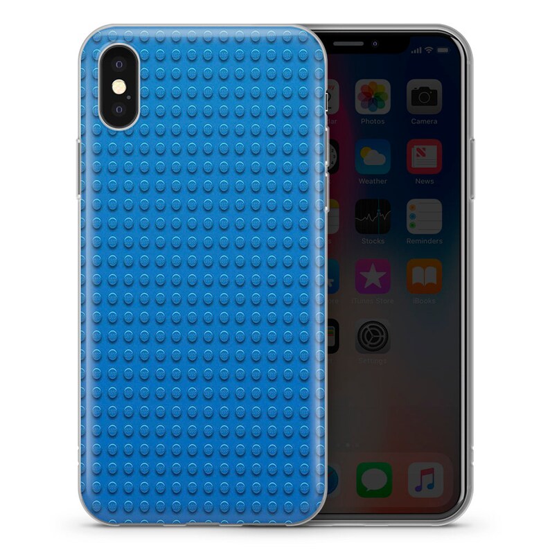 May include: A clear phone case with a blue Lego-like pattern on the back. The case is designed for an iPhone.