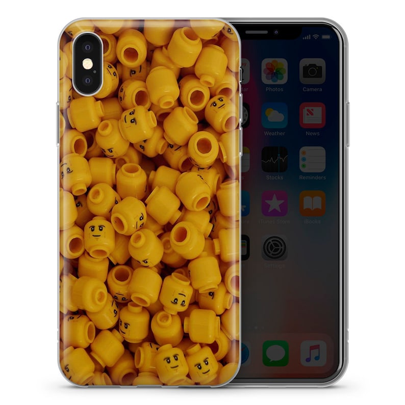 May include: A clear phone case with a design of yellow Lego heads. The case is designed for an iPhone.