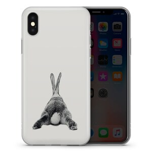 May include: A white iPhone case with a black and white image of a rabbit's rear end.