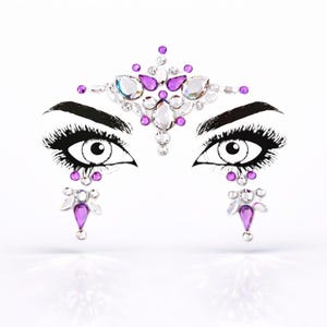 May include: A face jewel design with two stylized eyes, long black eyelashes, and a symmetrical arrangement of clear and purple rhinestones. The design is placed above and below the eyes, creating a glamorous and decorative effect.