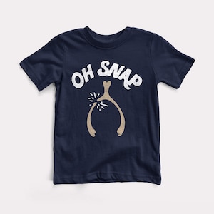 May include: A navy blue t-shirt with a white graphic of a wishbone with the text "OH SNAP" above it.