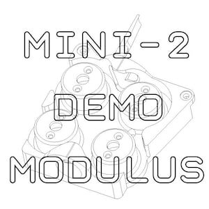 May include: Line drawing of a mechanical device labeled "MINI-2 DEMO MODULUS". The device has four circular components with internal gears and a lever.