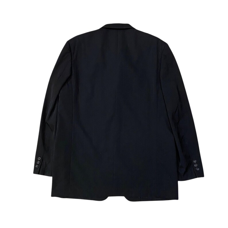 May include: A black blazer with a two-button closure and three buttons on each sleeve. The back of the blazer is visible, showing a classic tailored design. The blazer is made of a smooth, solid fabric.