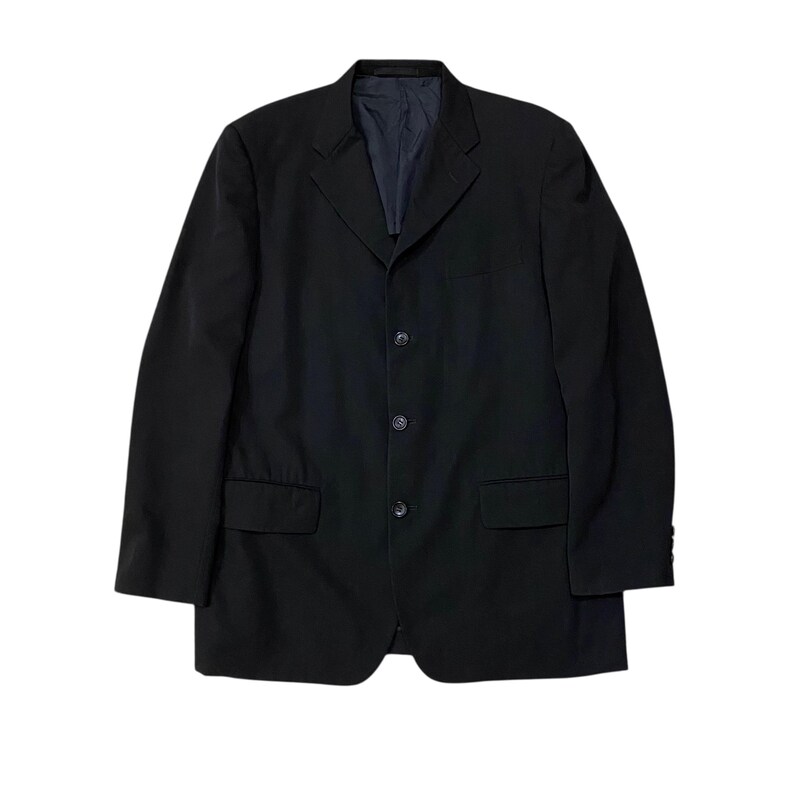 May include: A black blazer with a three-button closure, two front pockets, and a notched lapel. The jacket has a classic design and a dark navy blue lining. The sleeves are long and the fabric appears to be a smooth, woven material.