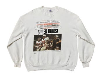 Vintage 90's Atlanta Falcons newspaper graphic sweatshirt.