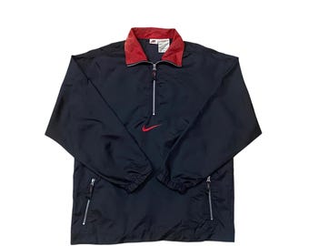 Chaqueta cortavientos Nike vintage de los años 90 con media cremallera y logotipo swoosh en el centro, talla L