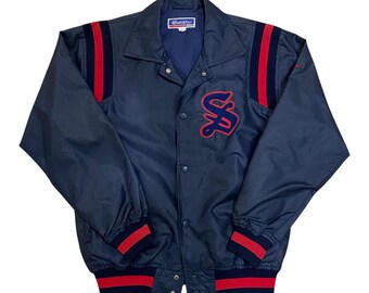 Chaqueta de béisbol vintage Mizuno World Wins azul marino con detalles en rojo y azul marino
