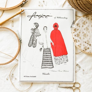 May include: A vintage sewing pattern for cloaks from Williamsburg, Virginia. The pattern features three different cloak designs, including a red cloak, a white cloak, and a black and white striped cloak. The pattern includes all sizes and is titled "Cloaks: Patterns From Historic Williamsburg".