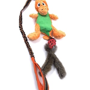 Paws Made ™ Dino Dangler - Bright Funky Bungee Dinosaur Holee Cage Rugby Tug Toy Dog Puppy Agility Flyball Training Toy RABBIT TAILS