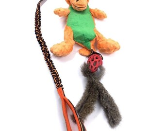 Paws Made ™ Dino Dangler - Heller Funky Bungee Dinosaurier Holee Cage Rugby Tug Toy Hund Welpe Agility Flyball Trainingsspielzeug RABBIT TAILS