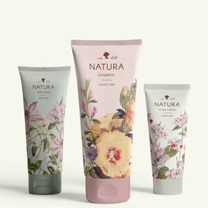May include: Three white tubes of body care products with floral designs. The tubes are labeled "Natura" and say "Body Lotion", "Shampoo", and "Hand Cream". All three tubes say "Cruelty Free".
