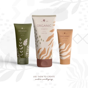 May include: Three tubes of organic body care products. The body lotion tube is olive green with white botanical illustrations. The shampoo tube is beige with brown abstract patterns. The hand cream tube is tan with brown wave patterns. The text "ORGANIC" is visible on each tube.