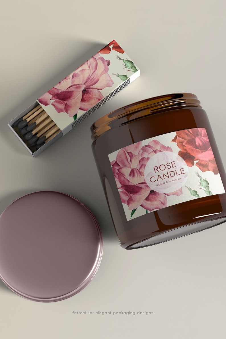 May include: A brown glass candle jar with a label that says "ROSE CANDLE organic & handmade" and features a watercolor illustration of pink roses. The candle jar is accompanied by a box of matches with a similar floral design.