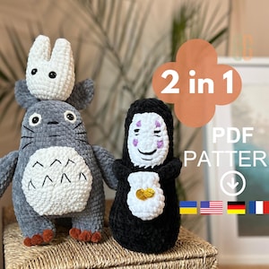 May include: Crochet pattern for two amigurumi plushies: a gray Totoro with a white bunny on its head and a black No Face with a white face and gold coins. The pattern is available in PDF format and includes instructions in multiple languages. 2 in 1 PDF PATTERN.
