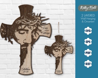 Puede incluir: Una decoración de pared y un adorno de madera de dos capas que presenta una cruz con una representación de Jesucristo. La cruz está hecha de madera y tiene un acabado marrón. La imagen de Jesucristo es detallada e incluye una corona de espinas. El texto "Yo estoy contigo siempre" está inscrito en la cruz. El texto "Mateo 24:20" también está inscrito en la cruz.