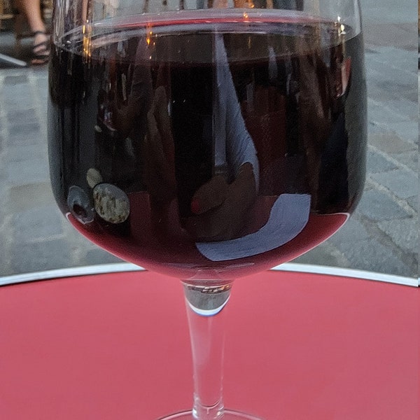 Wine at Sidewalk Cafe in Paris, France.