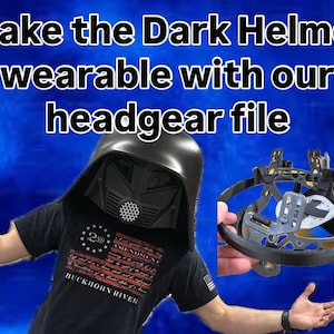 May include: A black helmet with a mesh face covering is worn by a person. The image includes the text "Make the Dark Helmet wearable with our headgear file." A headgear file is held in the person's hand. The person is wearing a black t-shirt.