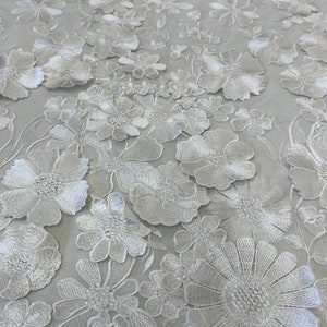 White 3D Bridal lace Fabric. 3D embroidery lace fabrc (available in other colors.)