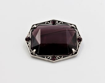 1950s Octagonal Pewter MIRACLE brooch with large rectangular faceted glass purple stone and 4 purple rhinestones