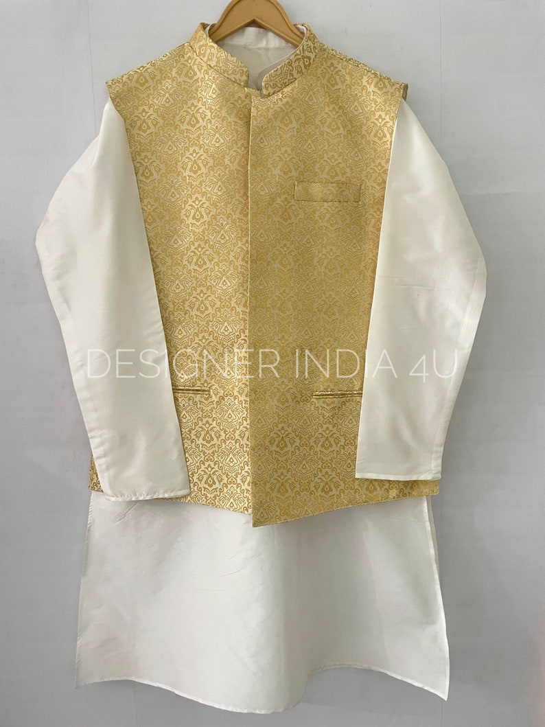 May include: A white kurta with long sleeves and a gold brocade waistcoat. The waistcoat has a mandarin collar and a button closure. The text "DESIGNER INDIA 4U" is visible on the image.