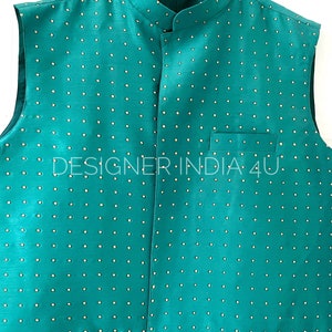 May include: A teal sleeveless vest with a mandarin collar and a white polka dot pattern. The vest has two pockets on the front and the text "DESIGNER INDIA 4U" is visible on the front.