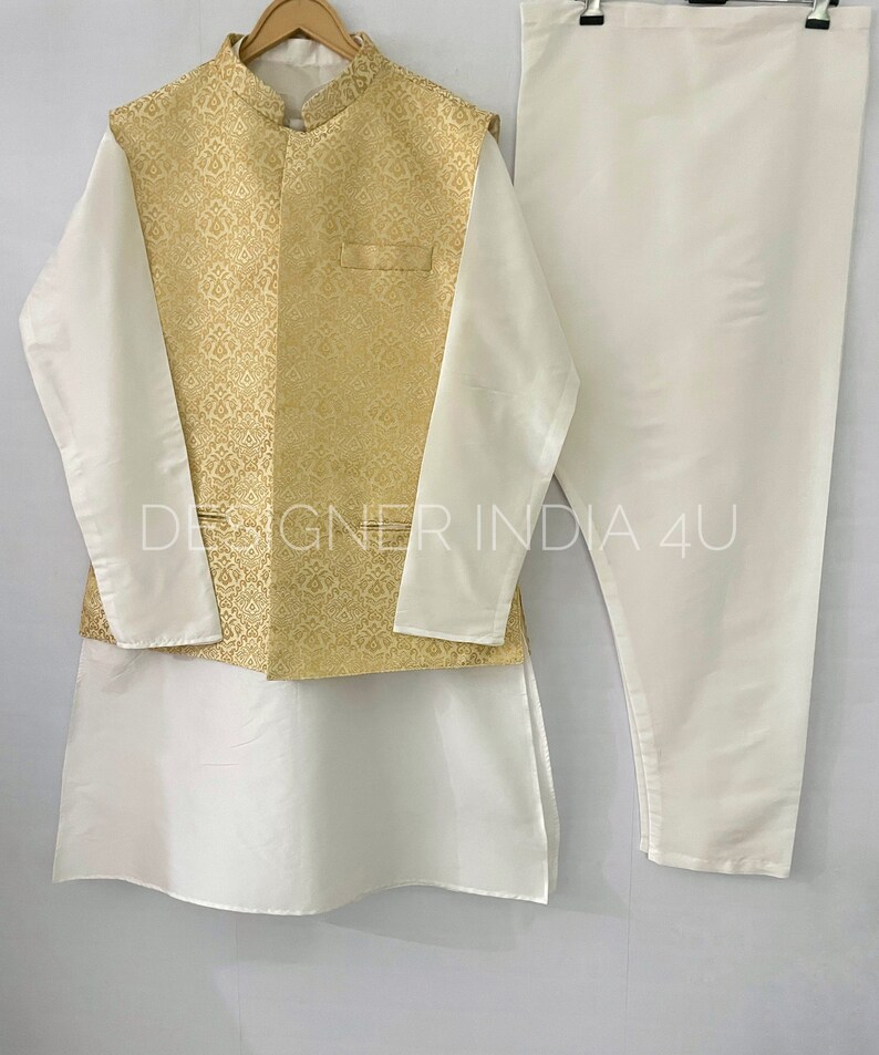 May include: A white kurta with long sleeves and a gold brocade waistcoat. The kurta has a mandarin collar and the waistcoat has a pocket on the left side. The text "DESIGNER INDIA 4U" is visible on the image.