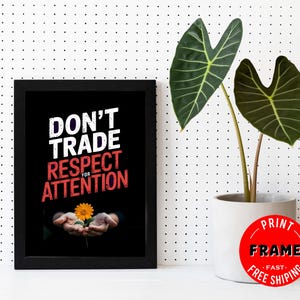 May include: A framed print with the text "DON'T TRADE RESPECT FOR ATTENTION" in white and red. The image features a person's hands holding a yellow flower. A potted plant with large green leaves is to the right.