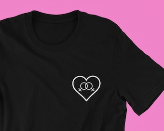May include: Black t-shirt with a white heart design featuring two interlocking female symbols.