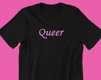 May include: Black t-shirt with the word "Queer" embroidered in a light purple color across the chest. The shirt is displayed against a pink background, highlighting the text.