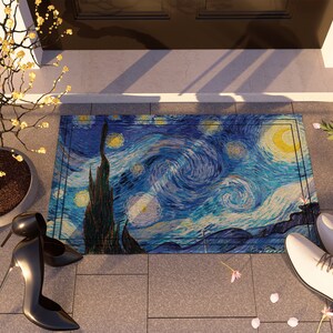 May include: A blue and yellow doormat with a painting of Van Gogh's Starry Night. The doormat is on a tiled floor with a potted plant and a pair of black high heels.