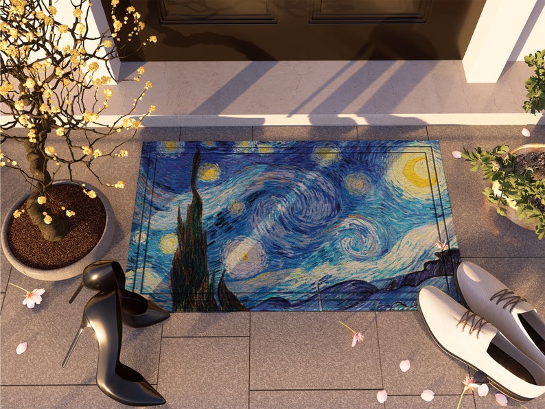 May include: A blue and yellow doormat with a painting of Van Gogh's Starry Night. The doormat is on a tiled floor with a potted plant and a pair of black high heels.