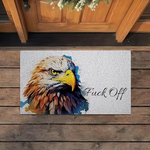 May include: A set of three ceramic mugs with a speckled, matte finish. The mugs are in shades of cream, light gray, and dark gray. Each mug has a simple, minimalist design and a rounded handle.