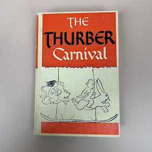 May include: A vintage book cover with an orange background and black text that reads "The Thurber Carnival". The cover features a black and white illustration of a carousel with a woman riding a dog and a man riding a rabbit.