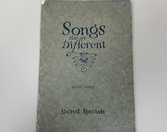 May include: A green book cover with the title "Songs that are Different" in black text. The book is part of a series called "Music" and is labelled "Book Three: Sacred Specials".