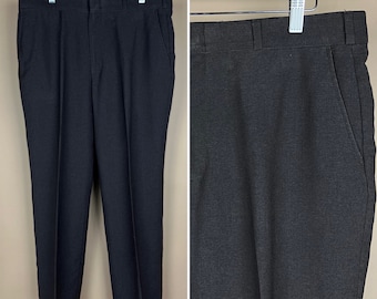 May include: A pair of dark gray dress pants with a straight leg and a classic fit.