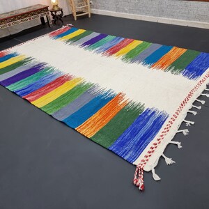 Zanafi Moroccan Rug
Flat Area Rug
Handmade Rug
Berber Rug
Custom Rug
Flatweave Kilim
Moroccan Rug
Blue and Yellow Rug
Striped Wool Rug